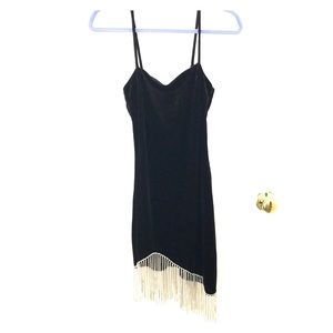 Black velvet spaghetti strap mini dress.